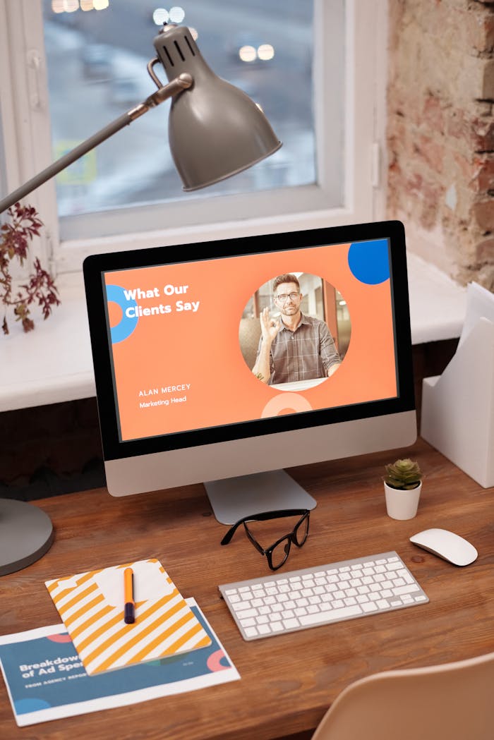 Services Stylish home office setup with computer showcasing client testimonials.